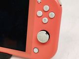 a pink nintendo wii game console with a black screen
