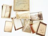 a lot of old photos in a box on the table