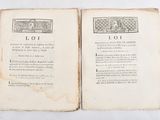 an old book opened to a page with a picture of a man and a woman on it