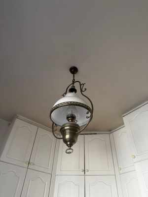 a light that is hanging from the ceiling in a room