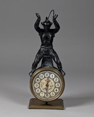 a statue of a man on top of a clock