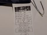 a black umbrella with a price tag attached to it