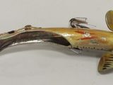 a fish that is sitting on top of a fishing hook