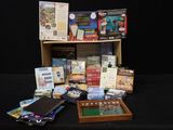 a wooden box filled with books and games on a black table