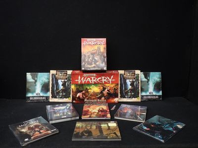 une table noire sur laquelle sont posés plusieurs DVD