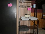 a black door and a shelf with a bowl on it