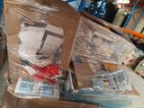 many boxes of items wrapped in plastic on the floor
