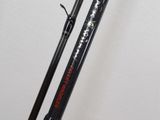 a close up of a pair of fishing rods on a stand