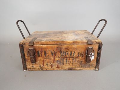 an old wooden box with metal handles and handles on a gray surface