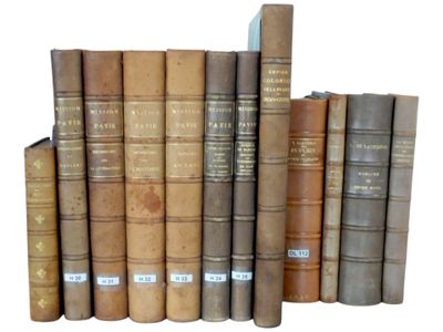 a lot of old books that are stacked on top of each other