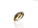 a close up of a ring with diamonds on a white surface