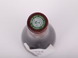 a bottle of wine that is sitting on a table
