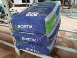 a stack of boxes sitting on top of a metal rack