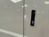 a remote control on the side of a white car