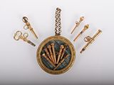 a gold locke with a bunch of keys hanging from it