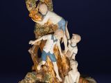 an image of a figurine of a woman and two children