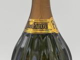 bottles of champagne are lined up in a row on a white surface