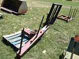 many different types of machinery in the grass