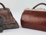 pair of brown leather purses on white background