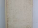 an old book on a white surface with a white background