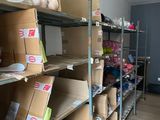 many boxes of shoes on the shelves in the room