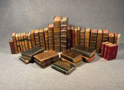 many old books stacked on top of each other