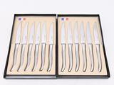 six knives in a black box with a white background