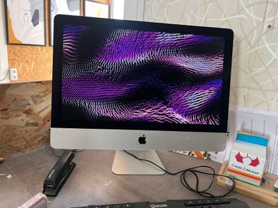 an image of a computer monitor and keyboard on a desk
