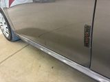 a close up of a car door with a sticker on it
