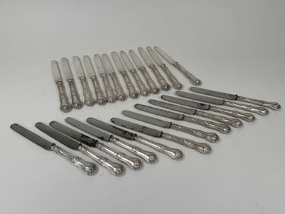 a lot of silver spoons that are on a table