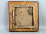 an old picture frame with a picture of a person in it