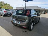 a small car that is parked in a parking lot