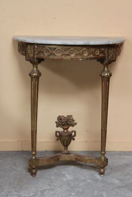 a small table with a vase on top of it
