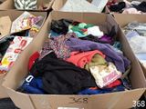 a box full of clothes sitting on a table