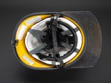 a close up of a fireman ' s helmet on a black background