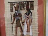 painting of a couple holding hands in front of a picture of an egyptian man and woman