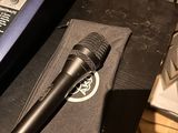 a microphone sitting on top of a box next to a laptop