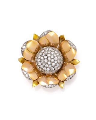 a gold and diamond flower broochle, by van cleef