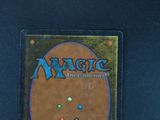a close up of a magic the gathering trading card on a table