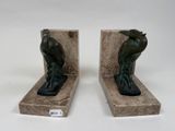 pair of art deco bookends of a man and a woman with a bird on their backs