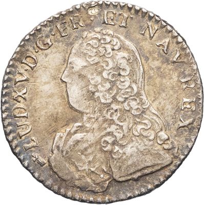 une pièce en argent avec l'image d'un homme de profil
