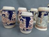 six blue and white coffee mugs sitting on top of a table