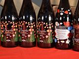 several bottles of wine are lined up on a table