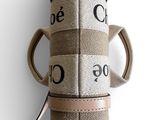 a roll of fabric with a cord attached to it