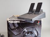 a box with a steering wheel and a game controller on it