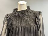 grey dress with ruffles and collar neckline on mannequin dummy