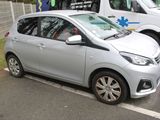 a silver car that is parked in a parking lot