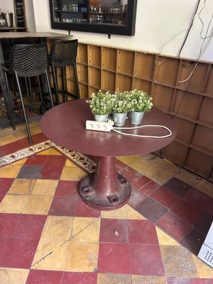 a small table with a potted plant on top of it