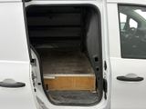 a white van with the door open on the side of the road