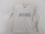the shirt is white and has the word boss on it